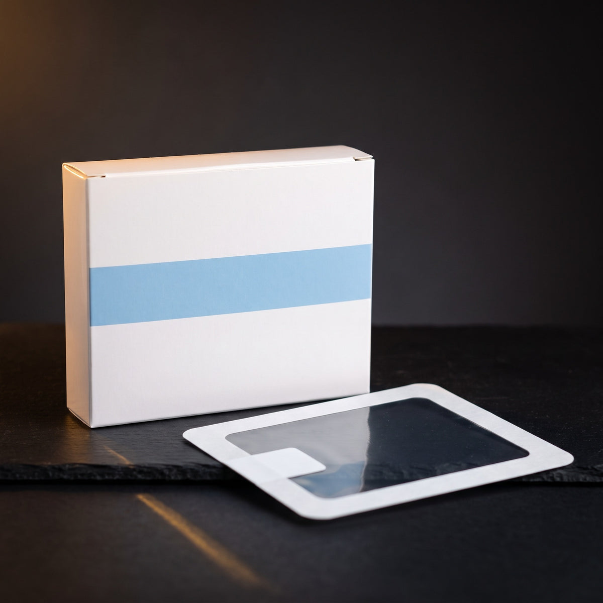 Transparent Film Dressing, 10 x 12 cm — studio hero on dark charcoal